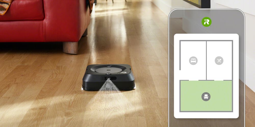 A black Braava robot and a smart map on a phone